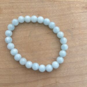 Stretchy bead bracelet in light blue/aquamarine.
